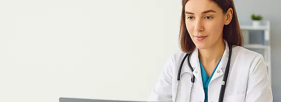 Doctor working at Laptop
